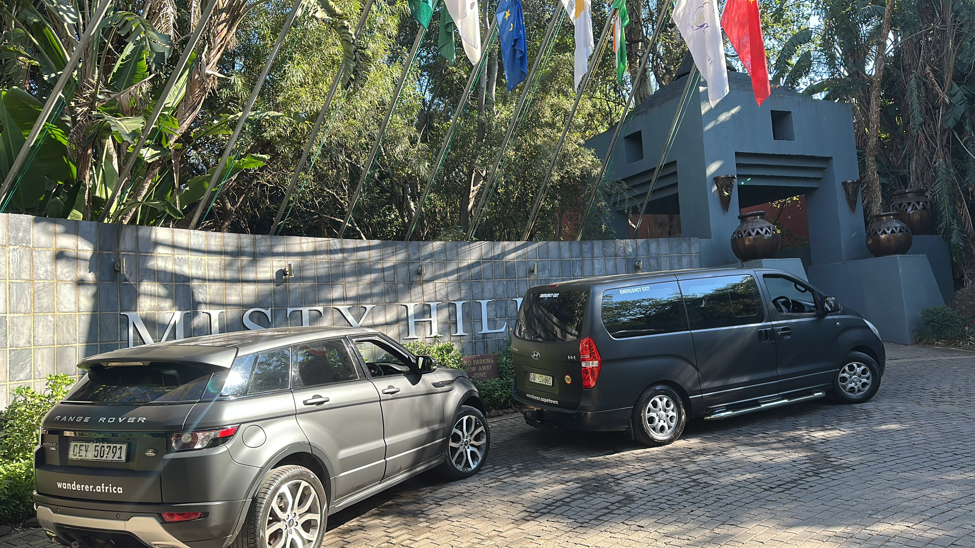 Hyundai van and Range Rover outside Misty Hills